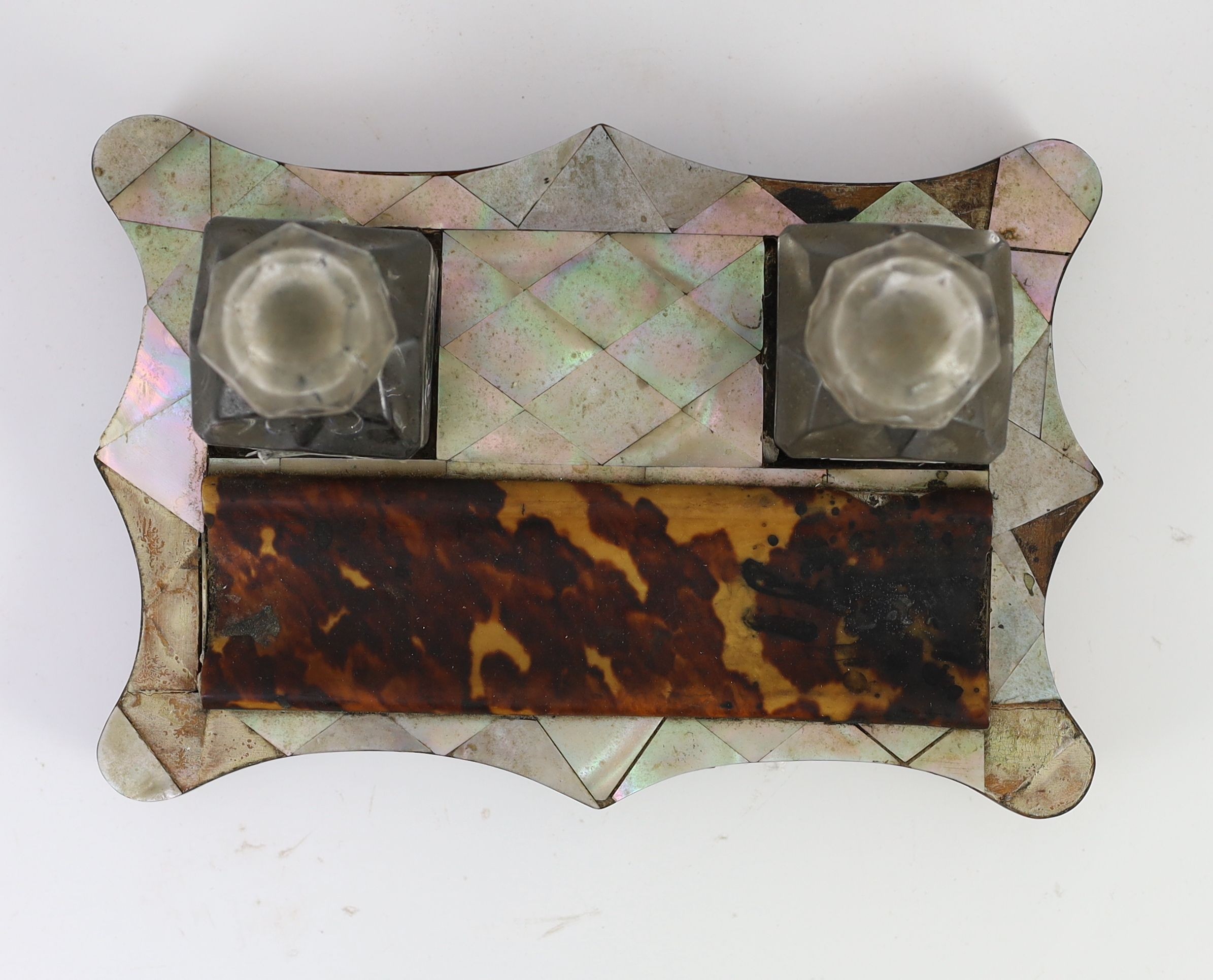 A Victorian tortoiseshell and mother of pearl inkstand, 21cm wide